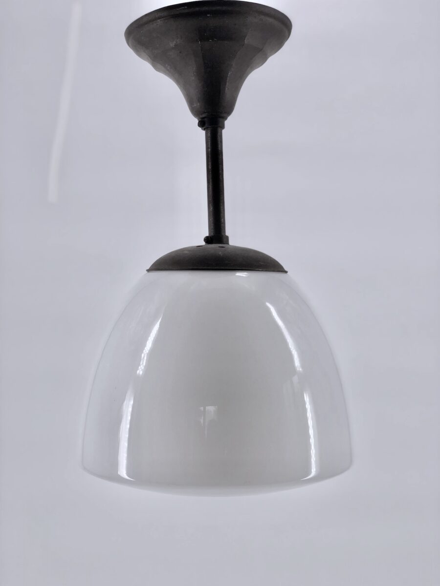 Patinated copper and opaline art deco pendant light.